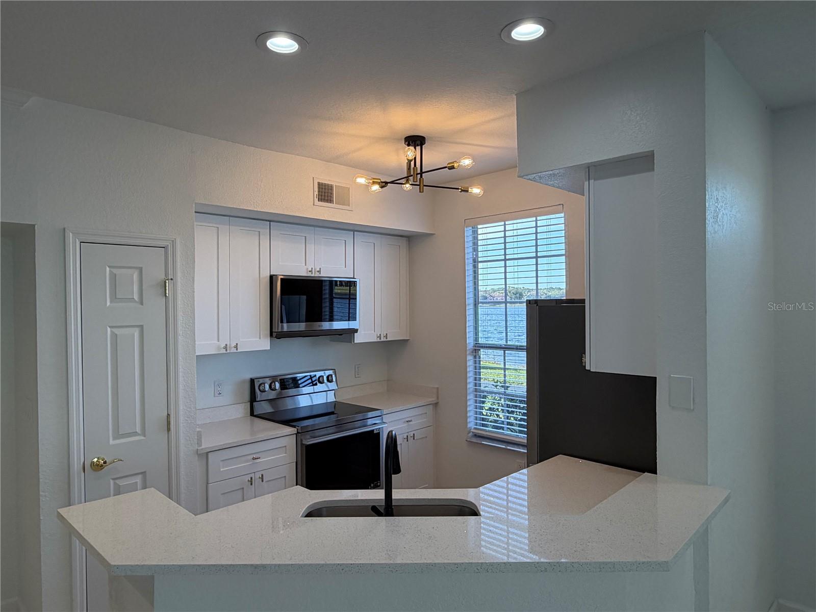 Image 4 of 26 For 9818 Lake Chase Island Way 9818