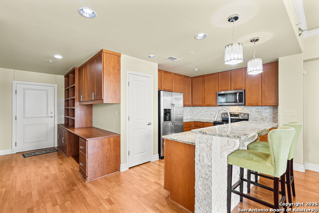 Listing photo id 0 for 215 Center St. N 1005